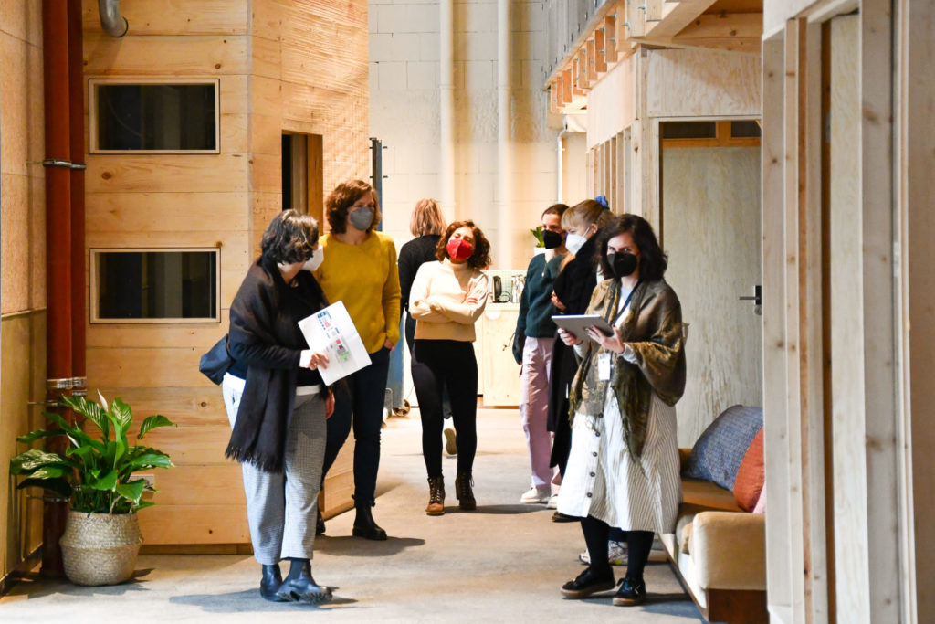 Group of sustainability entrepreneurs touring the Impact Hub Berlin coworking space