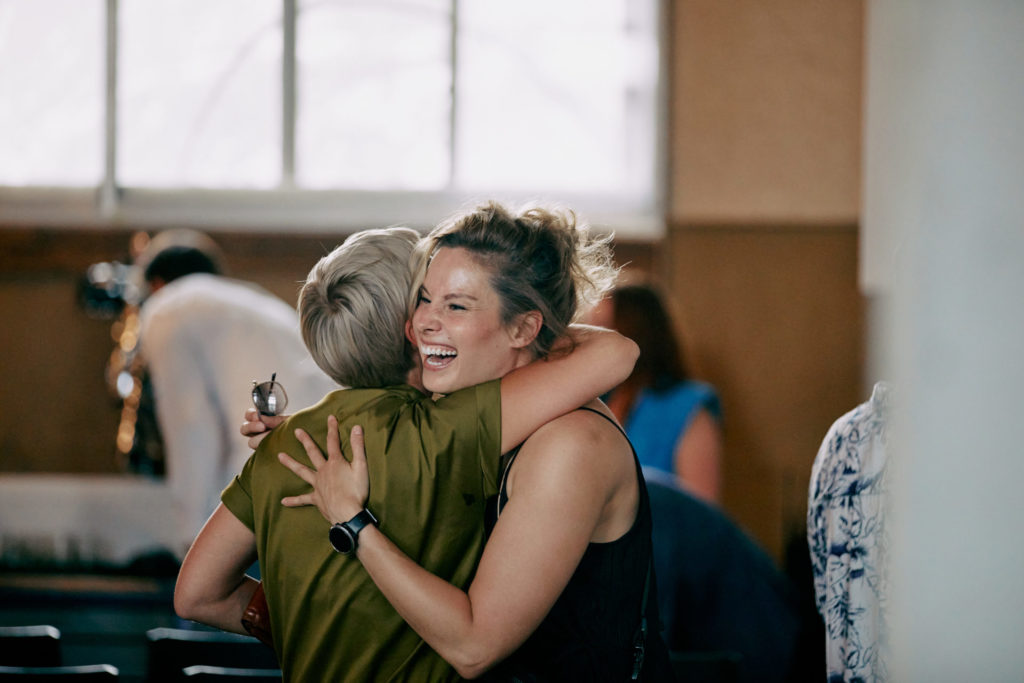 Two community members hugging at Impact Hub Berlin