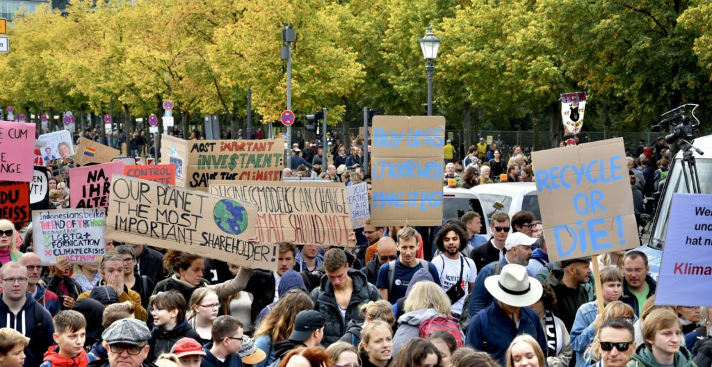 Crowd walking with signs on the Global Climate Strike