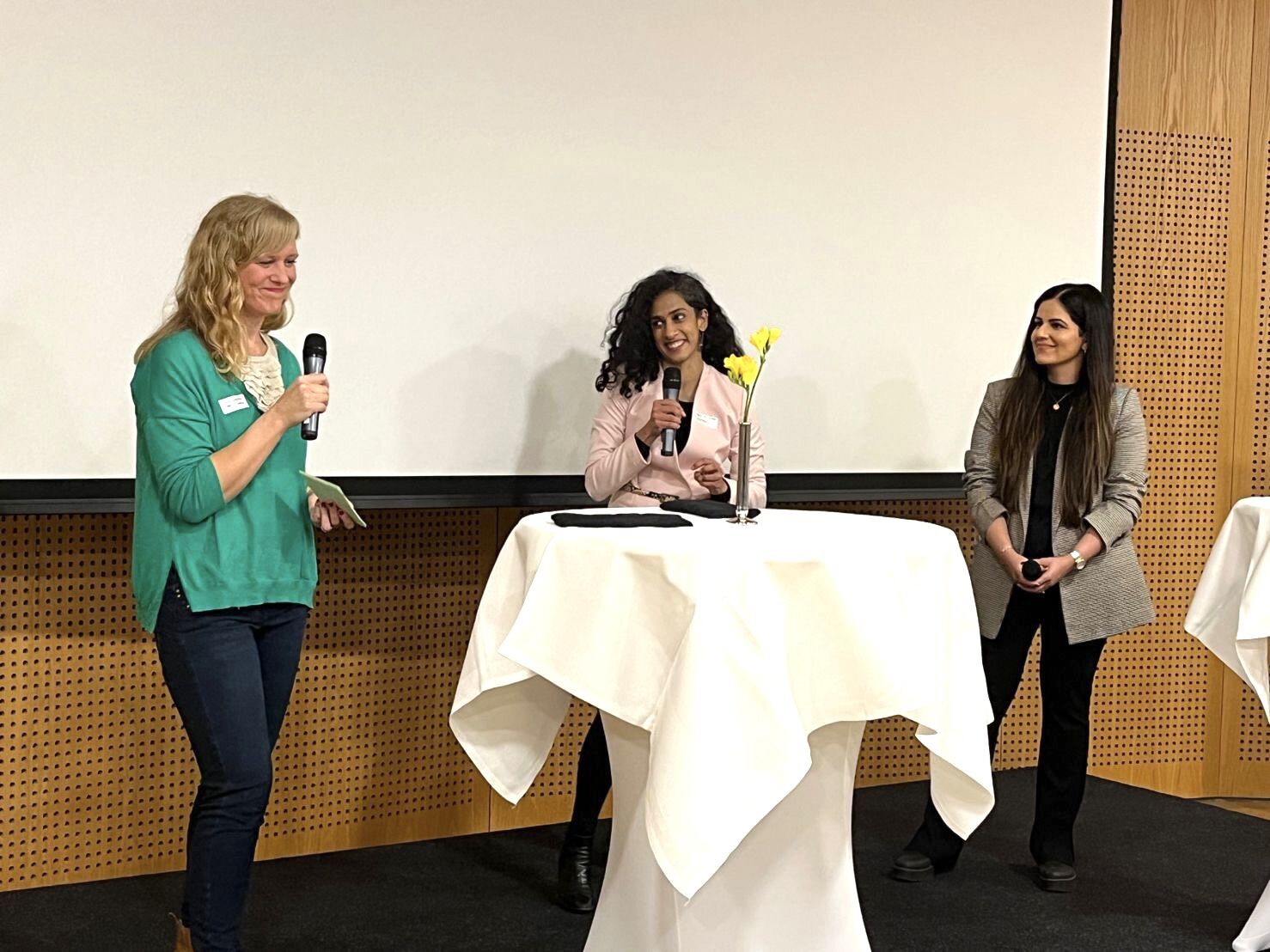 Three women having a panel discussion at the Women in Green Tech event