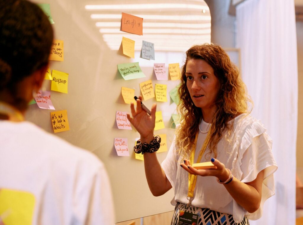Impact programme participants having a creative discussion